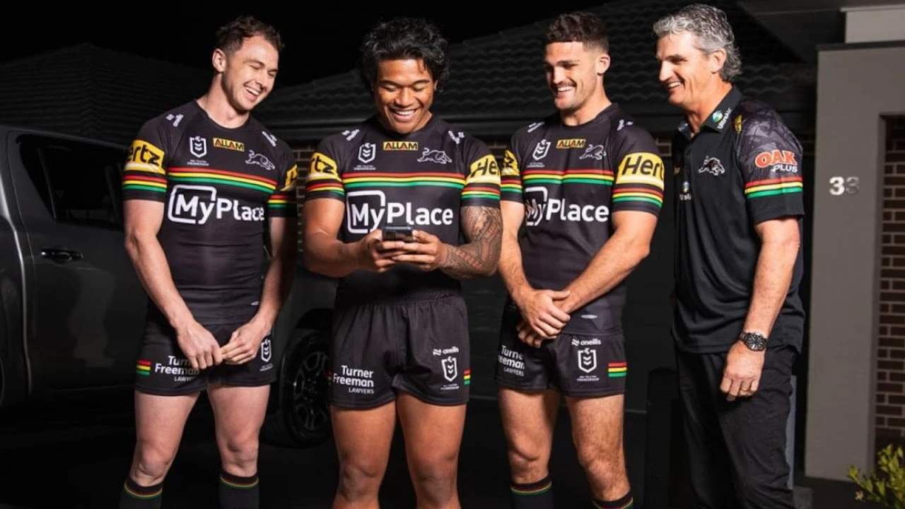 Penrith Panthers players checking the MyPlace smart home app
