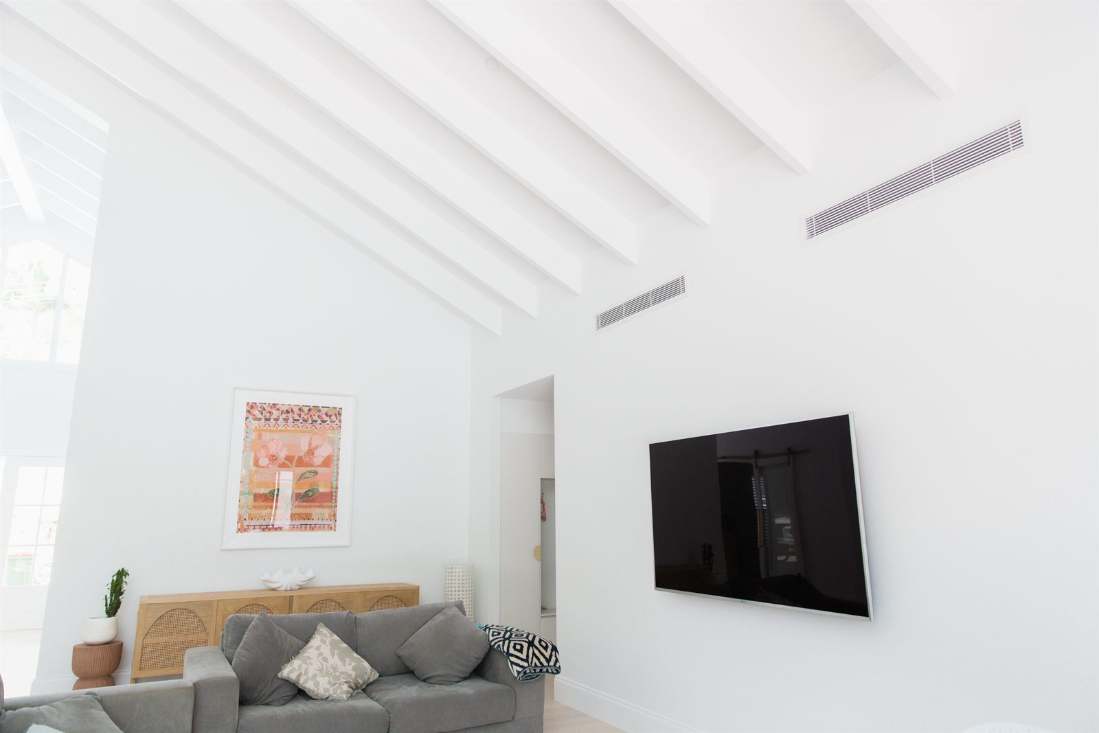 Discreet ducted air conditioning vents in a bright Gold Coast living room